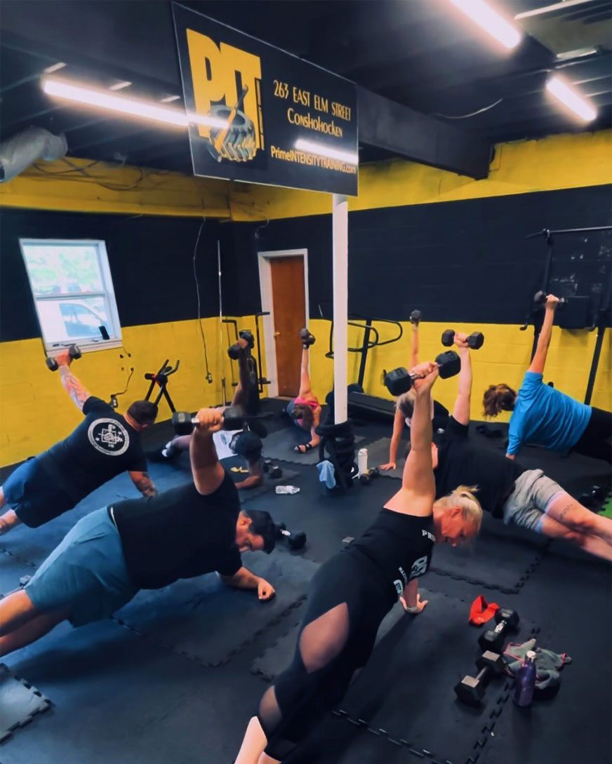 PIT Conshohocken gym coach leading a group fitness class showing real community and accountability
