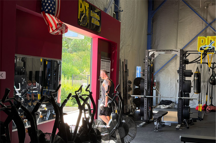 Dumbbells vs. Barbells: How PIT Uses Each to Build Strength That Lasts, and Why the Answer Is Never Just One